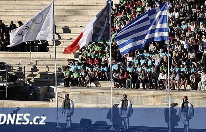 Greek and French athletes handed over the Olympic torch in Athens