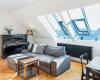 The interior of the attic apartment has an elegant Nordic style